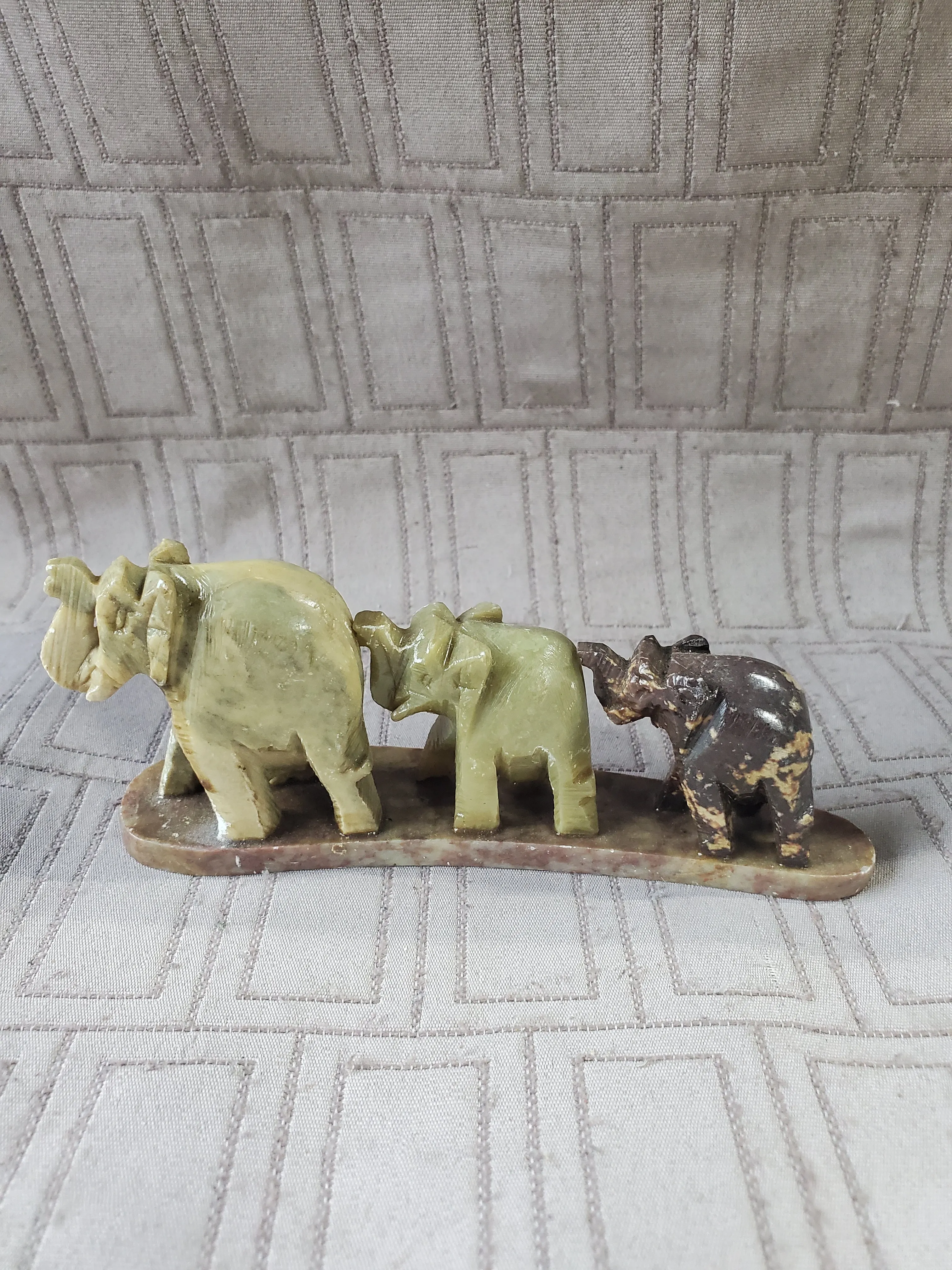 Carved Stone Elephants in a Line Paperweight